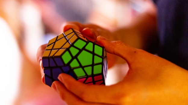 A Person Holding A Rubik’s Cube