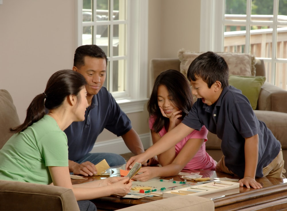 A Family Playing Monopoly