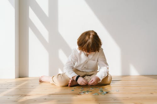 A kid solving a puzzle 