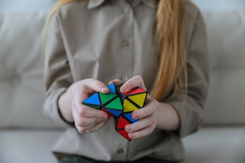 A person solving a Rubix cube