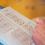 man playing sudoku